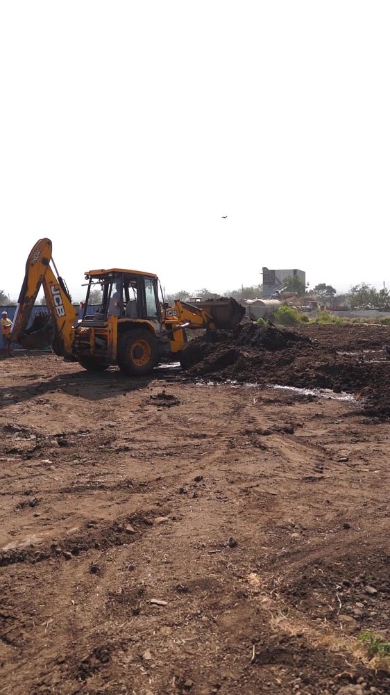 Machine handling material in the outdoor KSBio facility yard